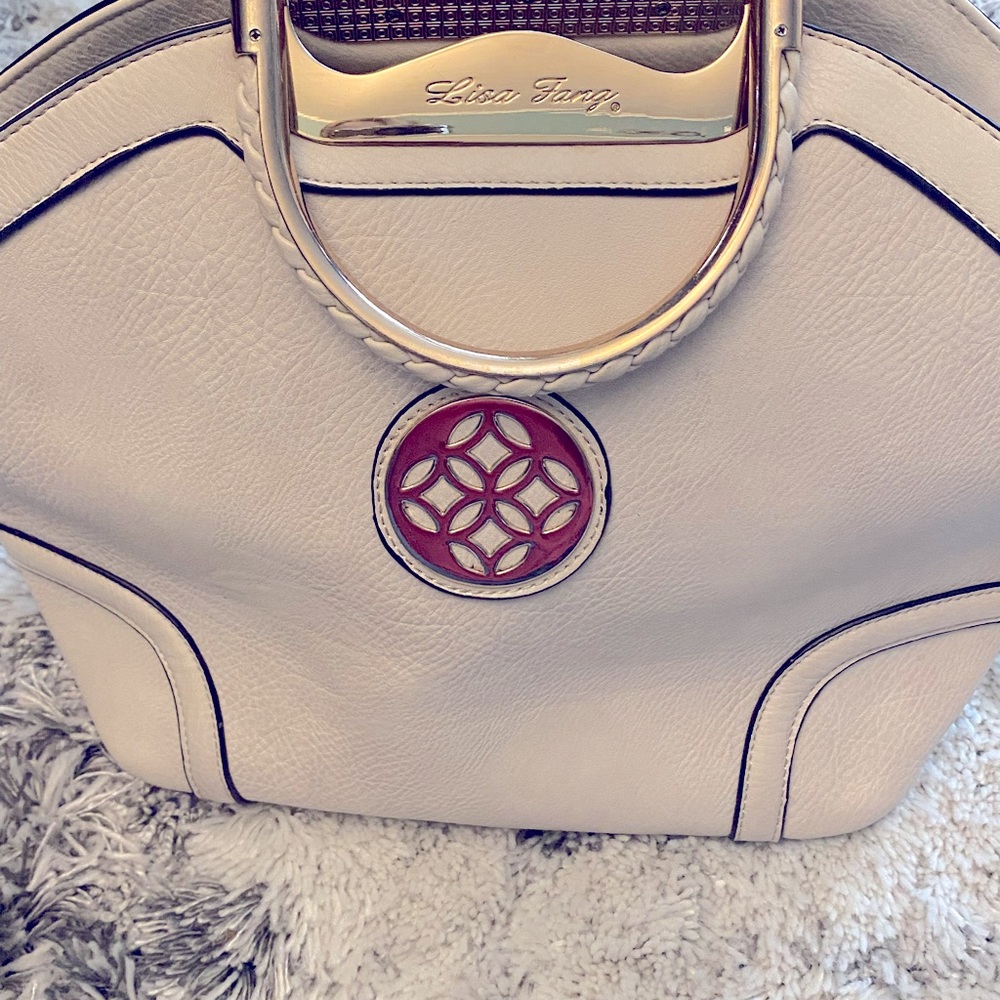 Lisa Fang Handbag in very good condition, Light tan and Gold in color